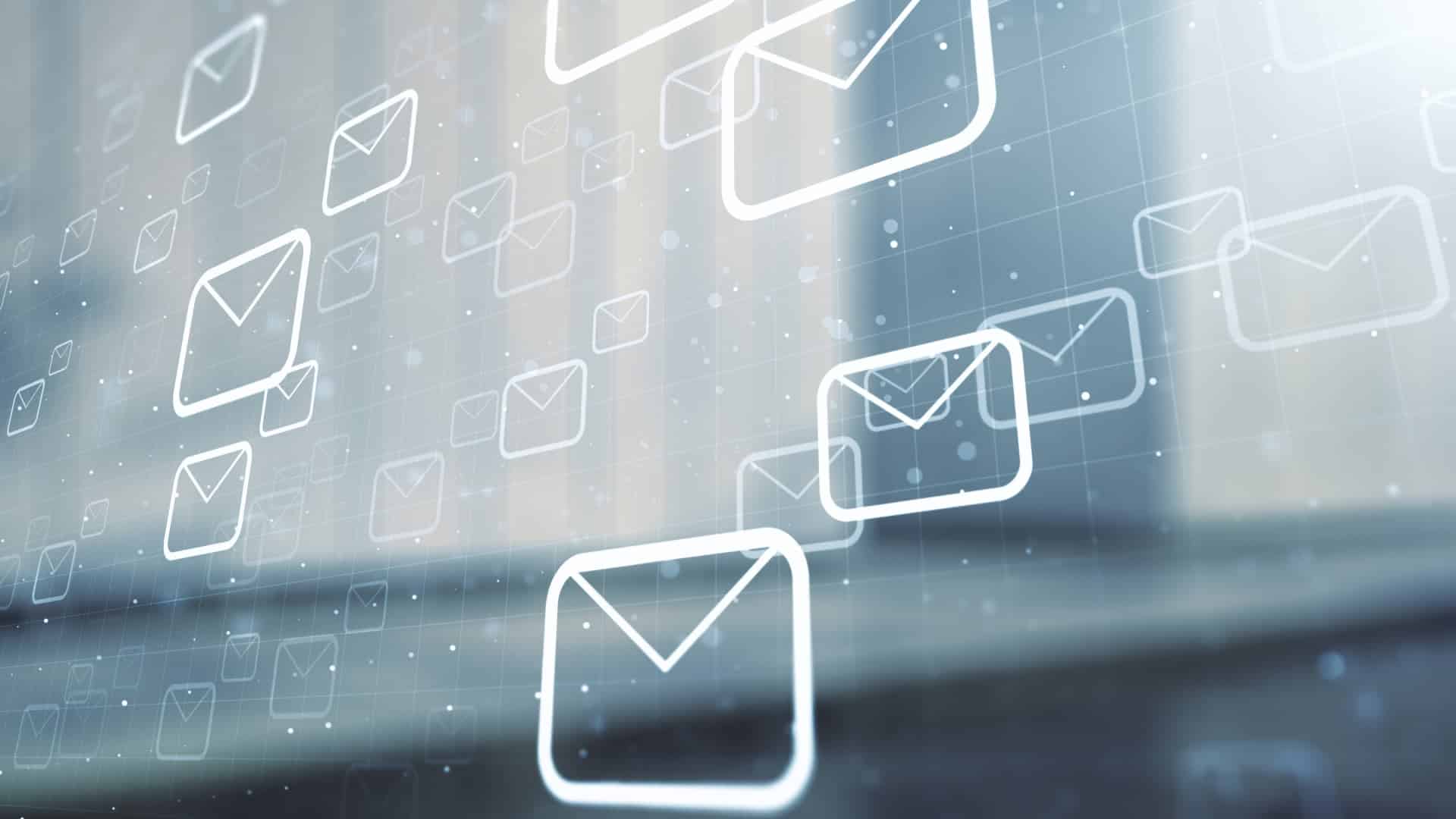 email automation icons on clear screens layered over each other