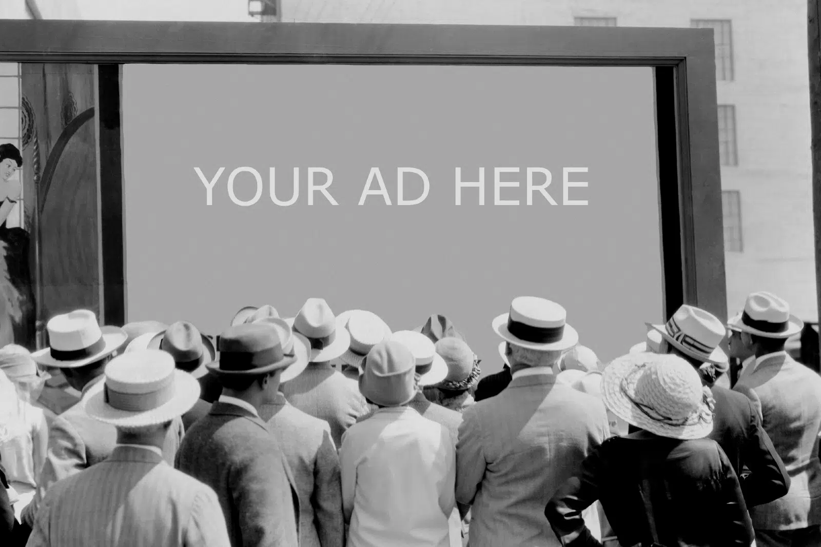 Black and white vintage photo looking at blank billboard with "Your Ad Here"