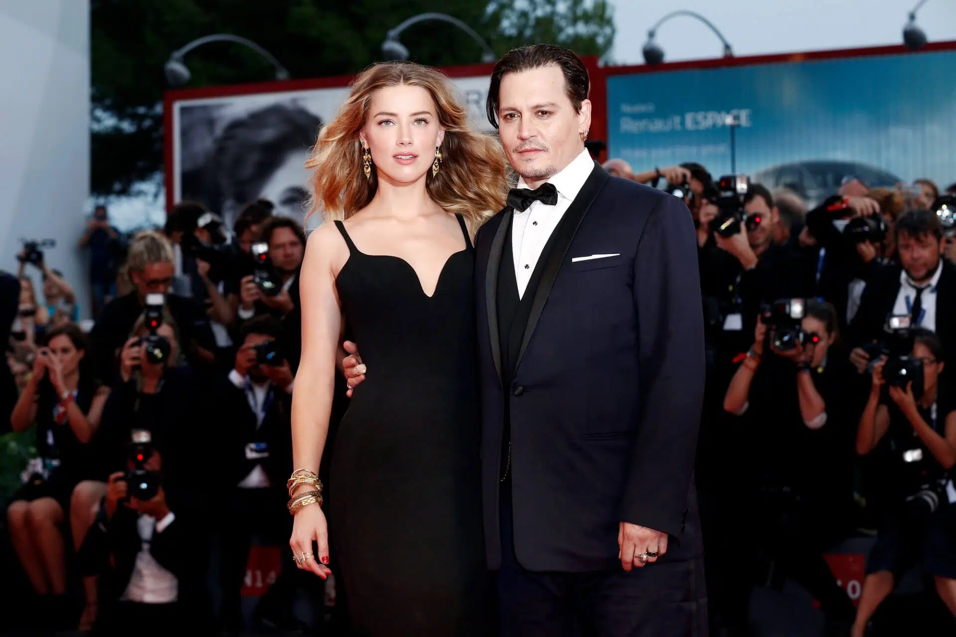 Johnny Depp and Amber Heard at a movie premiere