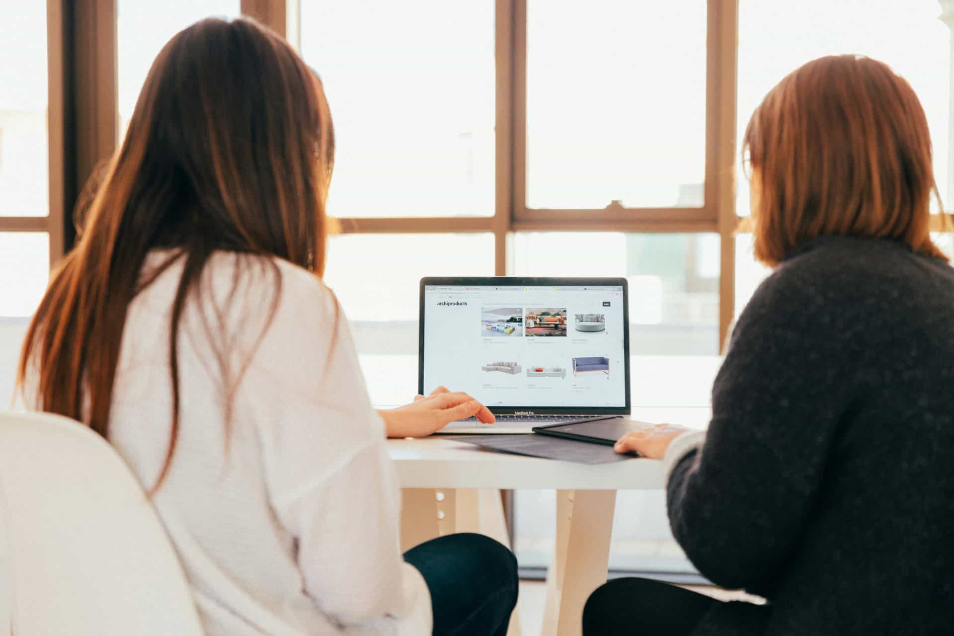 2 women examining an ecommerce website